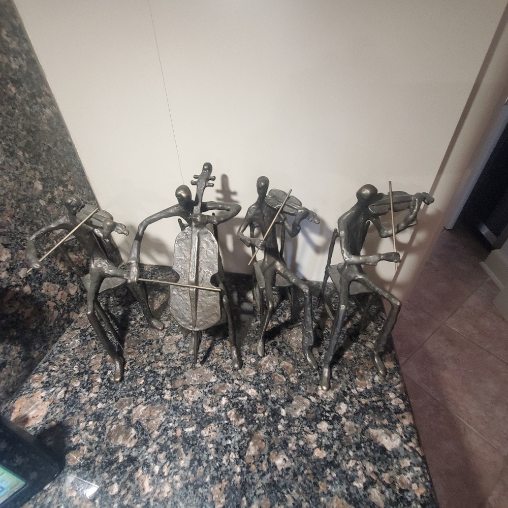 4 sculpted musicians as a set or individually. very cool,well sculpted.